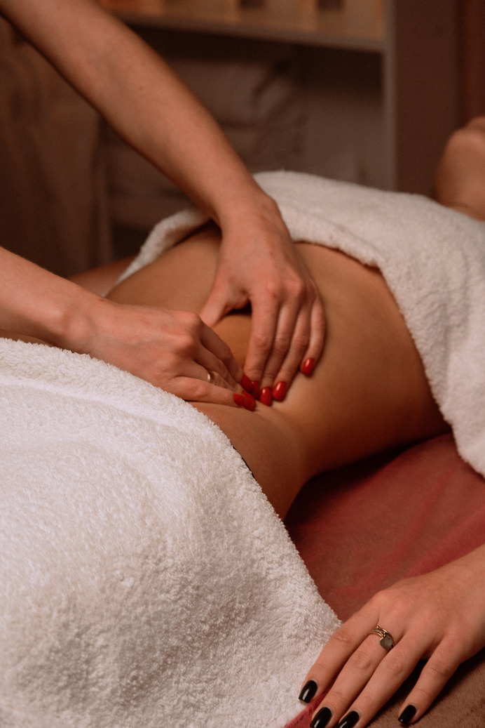 Hands of Masseuse Massaging